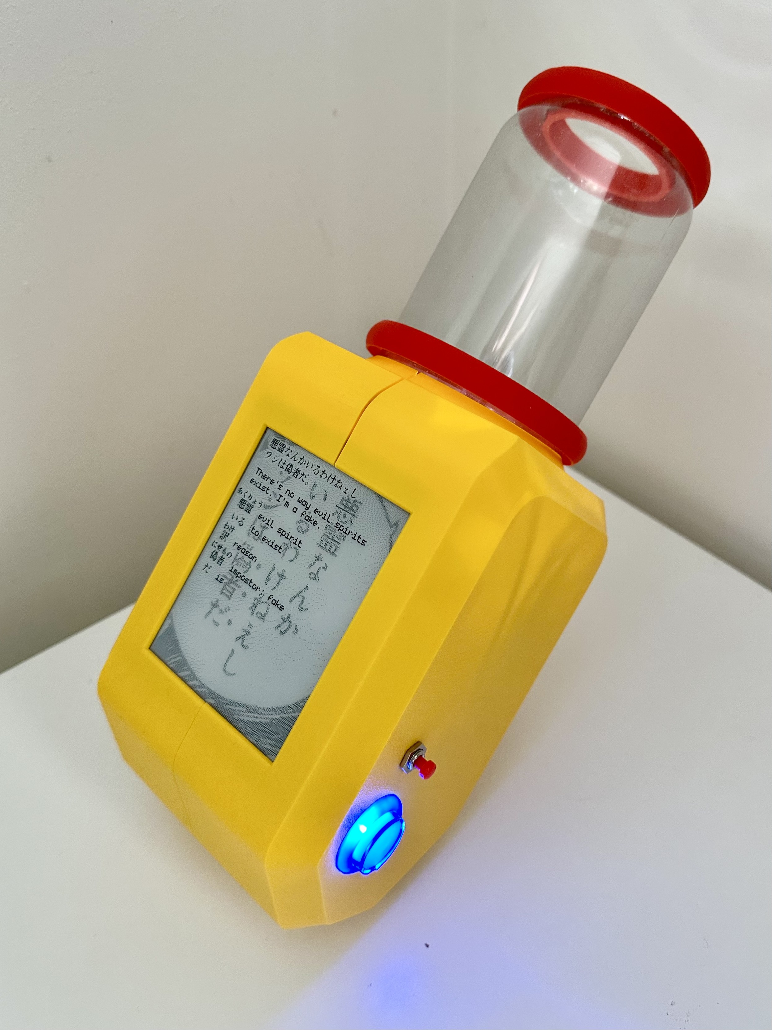 a gizmo sitting on a white desk