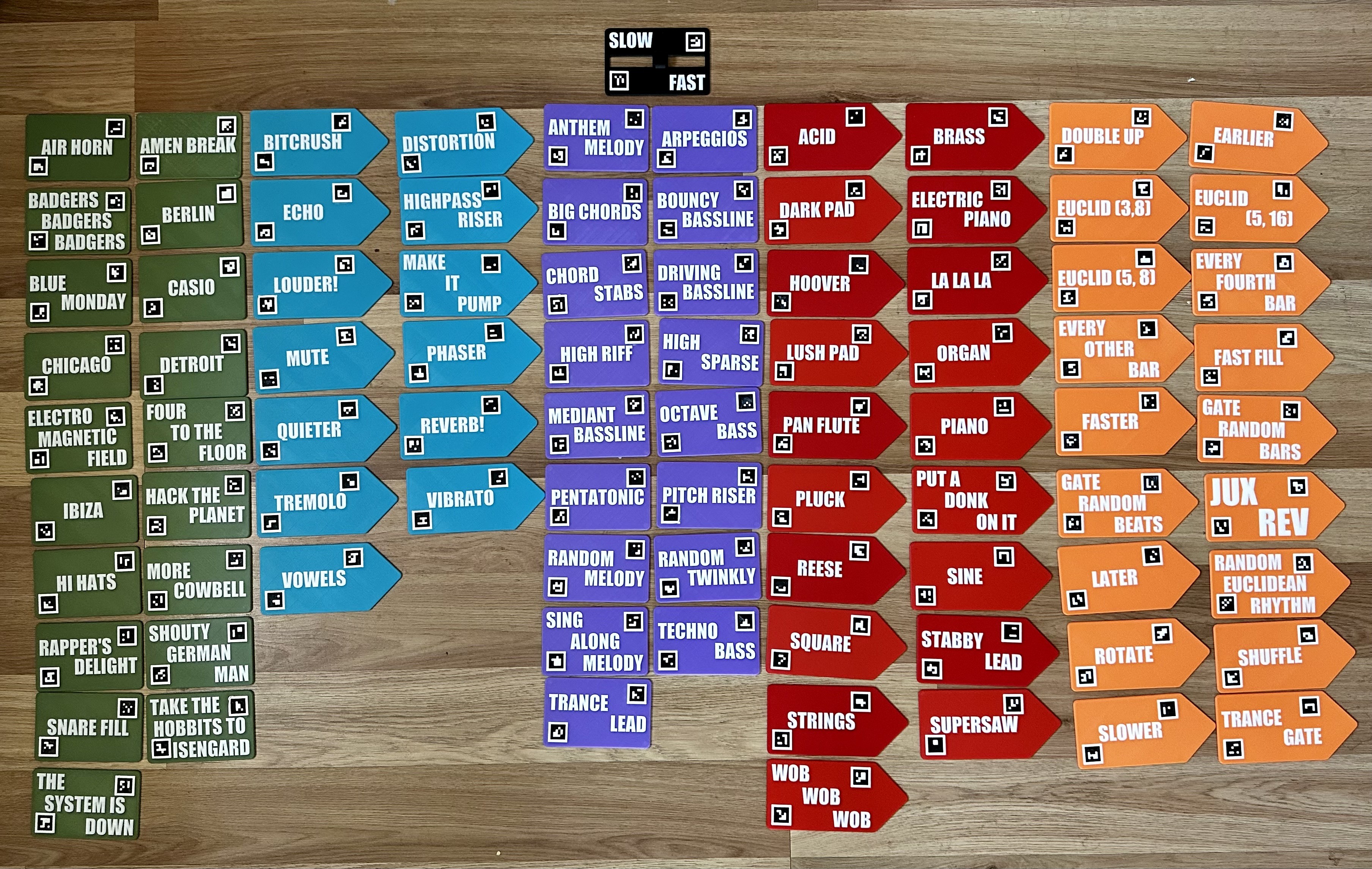 an array of colored tiles with music-themed text on them
